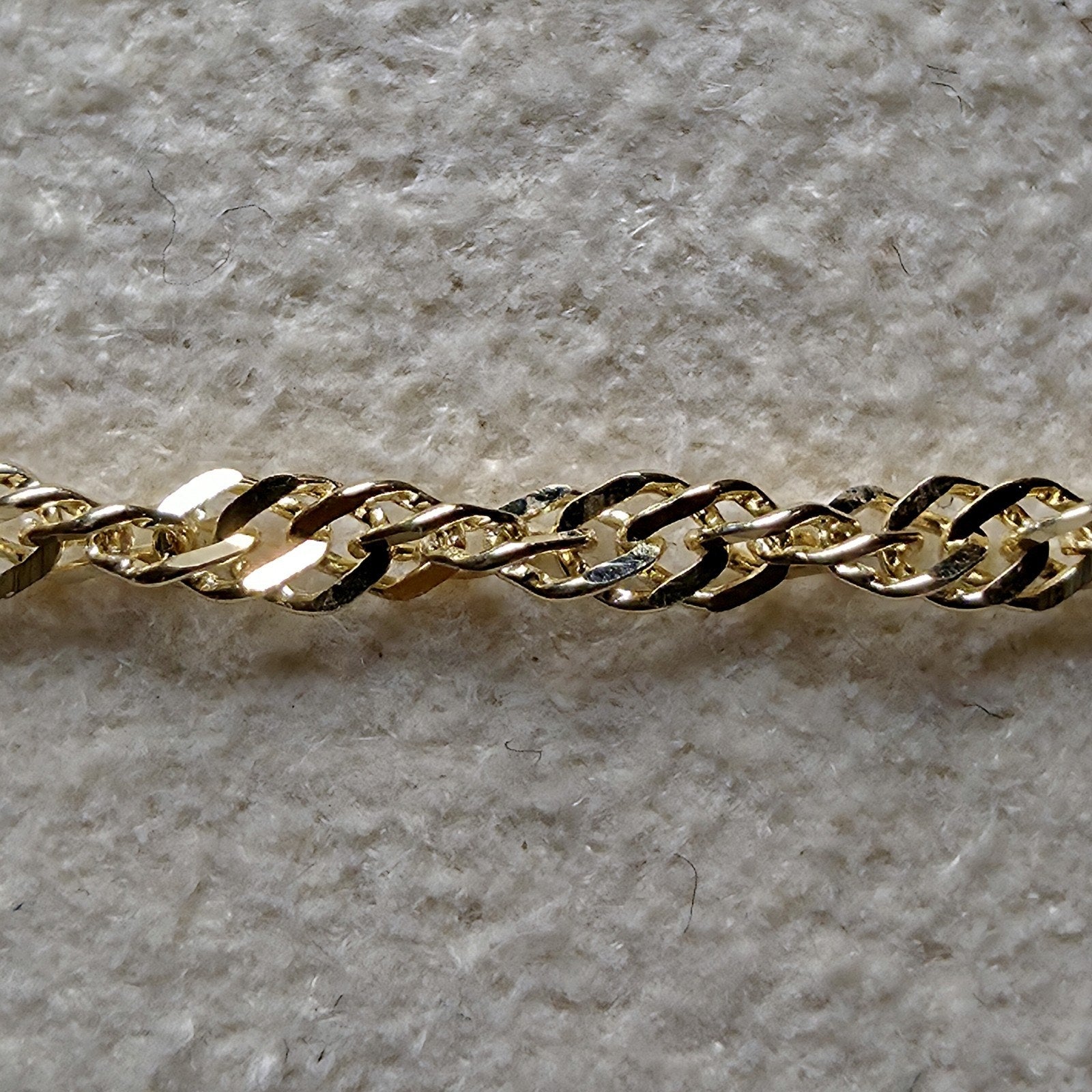 10K Yellow Gold 1.2mm Singapore Bracelet 7"